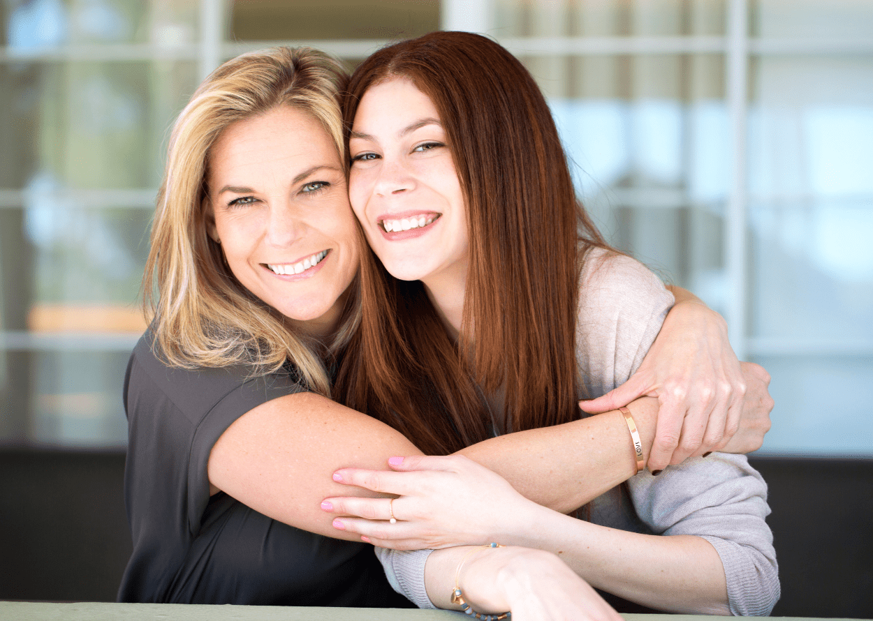 Mother and daughter hugging, showing their strong bond