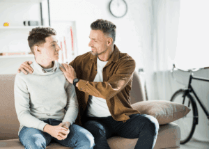 Father parenting teen son going beyond the rules to build character