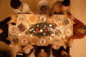 Family gathered around a table connecting