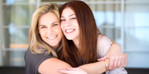 Mother and daughter hugging, showing a strong bond