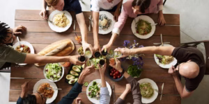Family gathered around a table connecting